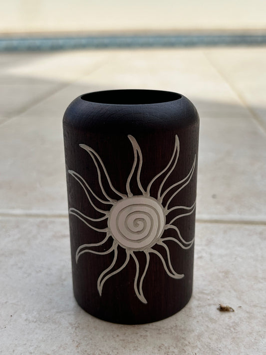 Candle holder with a sun