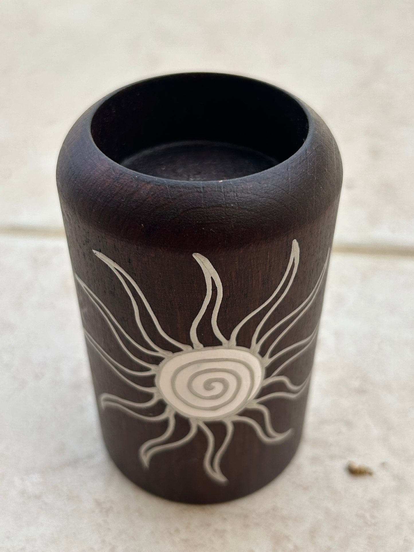 Candle holder with a sun